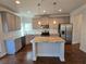 Modern kitchen with stainless steel appliances and granite countertops at 1455 Weeping Tree Cir, Auburn, GA 30011