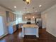 Modern kitchen with stainless steel appliances and granite countertops at 1455 Weeping Tree Cir, Auburn, GA 30011