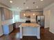 Modern kitchen with stainless steel appliances and granite countertops at 1455 Weeping Tree Cir, Auburn, GA 30011