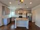 Modern kitchen with stainless steel appliances and granite countertops at 1455 Weeping Tree Cir, Auburn, GA 30011