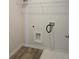 Laundry room with vinyl flooring and shelving at 1455 Weeping Tree Cir, Auburn, GA 30011