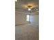 Large main bedroom with ceiling fan and neutral carpeting at 1455 Weeping Tree Cir, Auburn, GA 30011