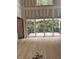 Living room with sliding glass doors leading to deck and unfinished wood floors at 3336 Ferncliff Ne Pl, Atlanta, GA 30324