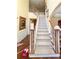 Elegant wooden staircase with carpet runner at 618 Rebecca Ives Nw Dr, Lilburn, GA 30047