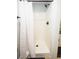 Clean shower with white walls and black fixtures at 1039 Ola Dale Dr, Mcdonough, GA 30252