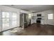 Open concept dining area with hardwood floors and stainless steel appliances visible at 4704 Apache Sw Trl, Atlanta, GA 30331