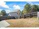 Private backyard with wooden fence and grassy area at 8785 Seneca Rd, Palmetto, GA 30268