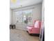 Serene bedroom with a pink rocking chair and natural light at 8785 Seneca Rd, Palmetto, GA 30268