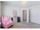 Bedroom with pink armchair and walk-in closet at 8785 Seneca Rd, Palmetto, GA 30268