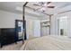 Spacious bedroom with large bed, dresser, and mirror at 8785 Seneca Rd, Palmetto, GA 30268