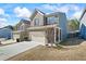 Two story home with attached garage and manicured lawn at 8785 Seneca Rd, Palmetto, GA 30268