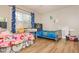 Bedroom with two twin beds, and wood-look flooring at 365 Winding River Dr # E, Atlanta, GA 30350