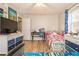 Bedroom with twin beds, a desk, and wood-look flooring at 365 Winding River Dr # E, Atlanta, GA 30350