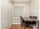Small dining area with table and chairs, built-in shelving, and tile flooring at 365 Winding River Dr # E, Atlanta, GA 30350