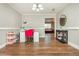 Bright dining room with hardwood floors and view into living room at 365 Winding River Dr # E, Atlanta, GA 30350