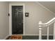Interior entryway with dark door and home welcome mat at 365 Winding River Dr # E, Atlanta, GA 30350