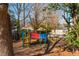 Colorful playground set in a wooded area at 365 Winding River Dr # E, Atlanta, GA 30350