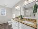 Bathroom with double sinks, granite countertop, and large mirror at 330 Pinehurst Way, Canton, GA 30114