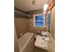 Updated bathroom with a tub and shower combination at 5737 Lorraine Dr, Stone Mountain, GA 30087