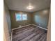 Spacious bedroom with wood-look floors and neutral walls at 5737 Lorraine Dr, Stone Mountain, GA 30087