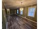 Spacious dining room offers a chandelier and wood-look flooring at 5737 Lorraine Dr, Stone Mountain, GA 30087