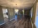 Open dining area with wood-look floors and view into living room at 5737 Lorraine Dr, Stone Mountain, GA 30087