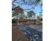 Front view of brick ranch house with attached carport and landscaping at 5737 Lorraine Dr, Stone Mountain, GA 30087