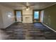 Bright living room with fireplace and ceiling fan at 5737 Lorraine Dr, Stone Mountain, GA 30087