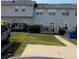 Townhouse backyard featuring a wooden deck and lawn at 125 Odyssey Turn, Conyers, GA 30012