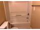 Bathroom featuring a toilet, bathtub, and towel rack at 125 Odyssey Turn, Conyers, GA 30012