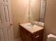 Bathroom vanity with mirror, faucet and fixtures at 125 Odyssey Turn, Conyers, GA 30012