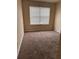 Bedroom featuring plush carpet and a window with natural light at 125 Odyssey Turn, Conyers, GA 30012