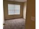Bedroom featuring plush carpet and a window with natural light at 125 Odyssey Turn, Conyers, GA 30012