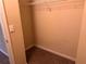 A small closet with carpet and a wire shelf for optimal storage solutions at 125 Odyssey Turn, Conyers, GA 30012