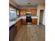 Updated kitchen features wood cabinets, granite counters, stainless steel appliances, and tile backsplash at 125 Odyssey Turn, Conyers, GA 30012
