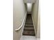 Carpeted stairway with white railing at 125 Odyssey Turn, Conyers, GA 30012