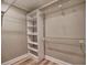 Walk-in closet with built-in shelving and ample storage space at 3412 Lake Pointe Cir, Roswell, GA 30075