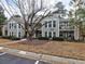 Exterior view of a two-story building featuring staircases, windows, and small balconies at 3412 Lake Pointe Cir, Roswell, GA 30075