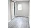 Bonus room featuring a modern barn door and sliding glass door, plus new flooring at 1421 Eason St, Atlanta, GA 30314