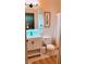 Bright bathroom featuring a vanity sink, mirror, toilet, shower with a curtain, and neutral-toned flooring at 94 Moury Se Ave, Atlanta, GA 30315