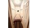 Small bedroom with a single bed and custom shelving in closet at 94 Moury Se Ave, Atlanta, GA 30315