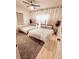 Inviting bedroom showcasing two beds with decorative throw pillows and a decorative ceiling fan at 94 Moury Se Ave, Atlanta, GA 30315