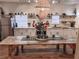 Farmhouse dining room featuring a large wooden table, pendant lighting, and white cabinets at 94 Moury Se Ave, Atlanta, GA 30315