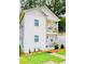 Two-story white house with a front porch and landscaped yard at 94 Moury Se Ave, Atlanta, GA 30315