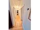 Hallway with hardwood floors, several doors, neutral color walls and a thermostat at 94 Moury Se Ave, Atlanta, GA 30315