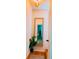 Inviting hallway with a decorative mirror, plant, and hardwood floors creates a warm and welcoming entrance at 94 Moury Se Ave, Atlanta, GA 30315