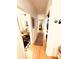 Hallway with hardwood floors, several doors, and access to a bathroom and bedroom at 94 Moury Se Ave, Atlanta, GA 30315