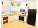 Well-lit kitchen featuring ample counter space, modern appliances, and plentiful cabinet storage at 94 Moury Se Ave, Atlanta, GA 30315