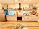 Modern kitchen with stainless steel appliances, sleek countertops, and ample cabinet space with wooden floors at 94 Moury Se Ave, Atlanta, GA 30315