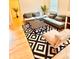 Open living room with comfortable seating, a large rug, and natural light, perfect for relaxing and entertaining at 94 Moury Se Ave, Atlanta, GA 30315